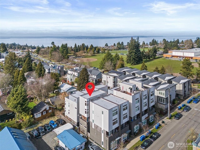 aerial view with a residential view and a water view