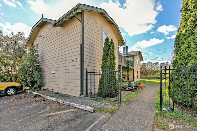 view of home's exterior with fence