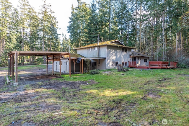 exterior space featuring driveway, a carport, and a wooden deck