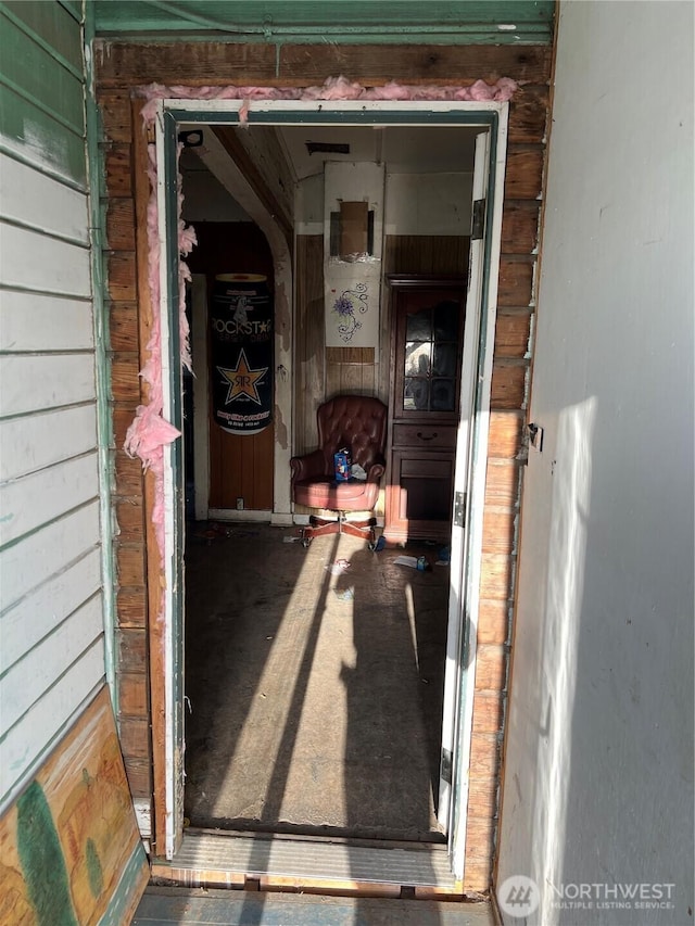 doorway to property with a garage