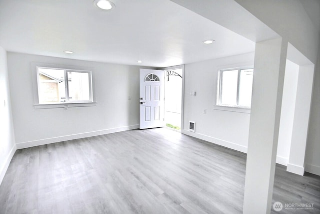 interior space with recessed lighting, wood finished floors, visible vents, and baseboards