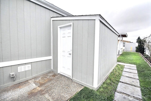 view of outbuilding featuring an outbuilding and fence