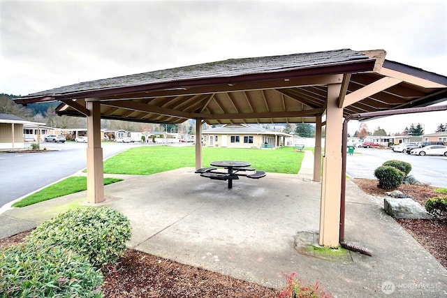 view of property's community with a gazebo, a yard, and a patio area