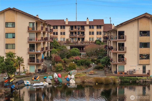 view of building exterior with a water view