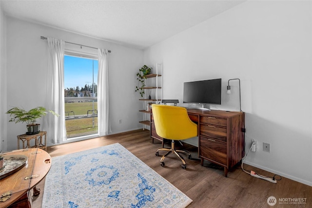 office area featuring baseboards and wood finished floors