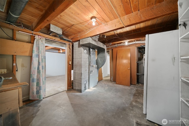 unfinished basement featuring heating unit