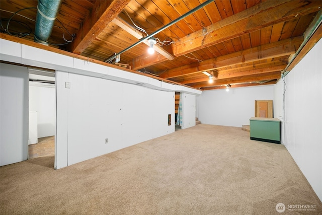 finished basement with carpet floors and wood ceiling