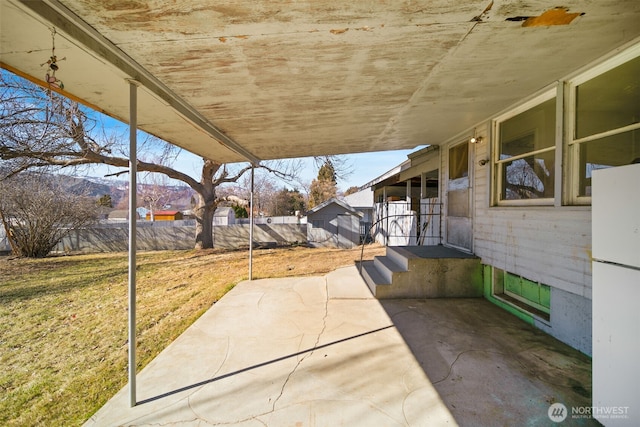 view of patio featuring fence