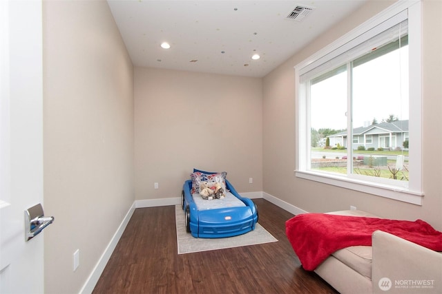 bedroom with recessed lighting, wood finished floors, visible vents, and baseboards