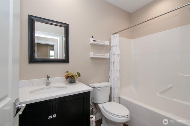 full bathroom featuring toilet, shower / bath combination with curtain, and vanity