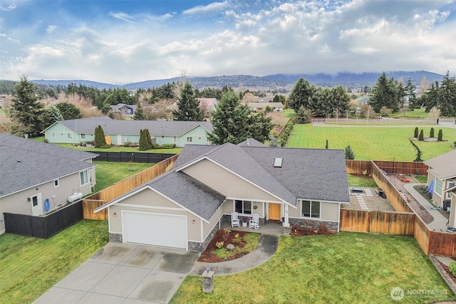 birds eye view of property with a residential view and a mountain view