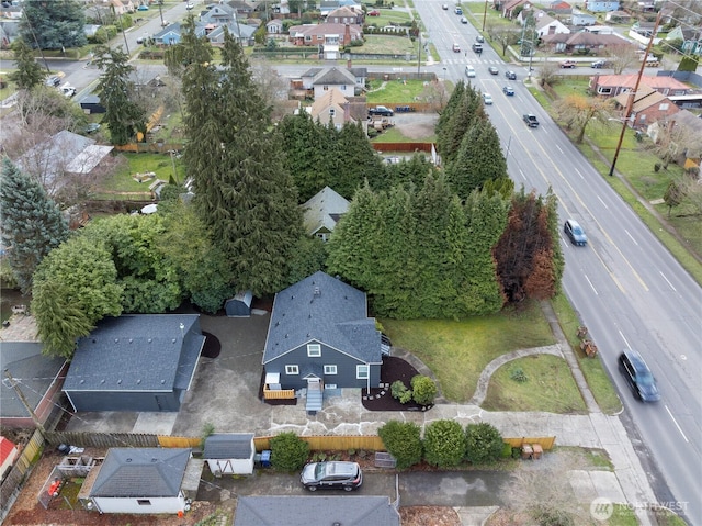 birds eye view of property with a residential view