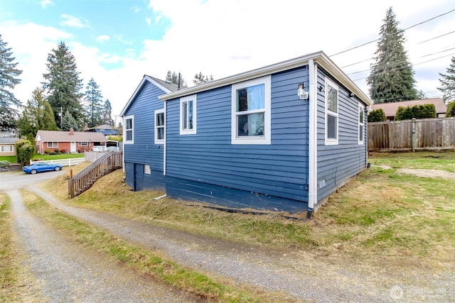 view of property exterior with fence