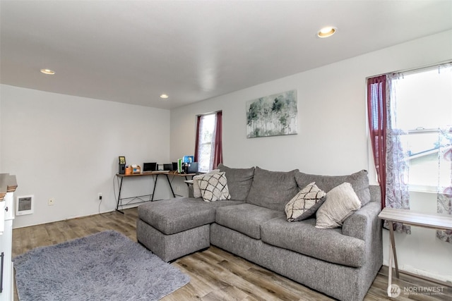 living room featuring wood finished floors and recessed lighting