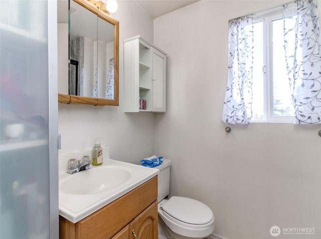 half bath with vanity and toilet