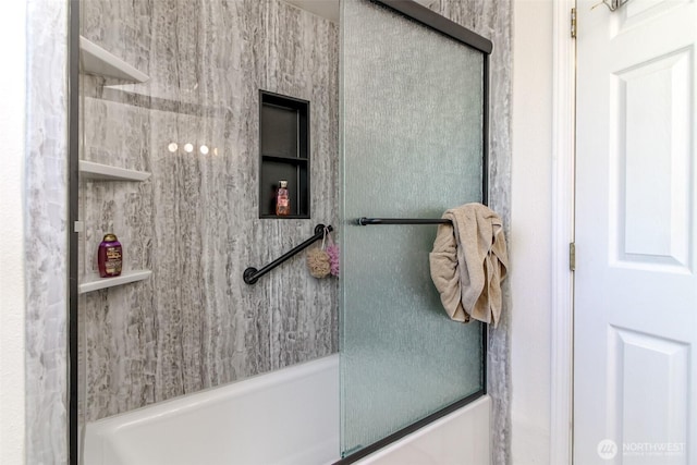 full bathroom with bath / shower combo with glass door