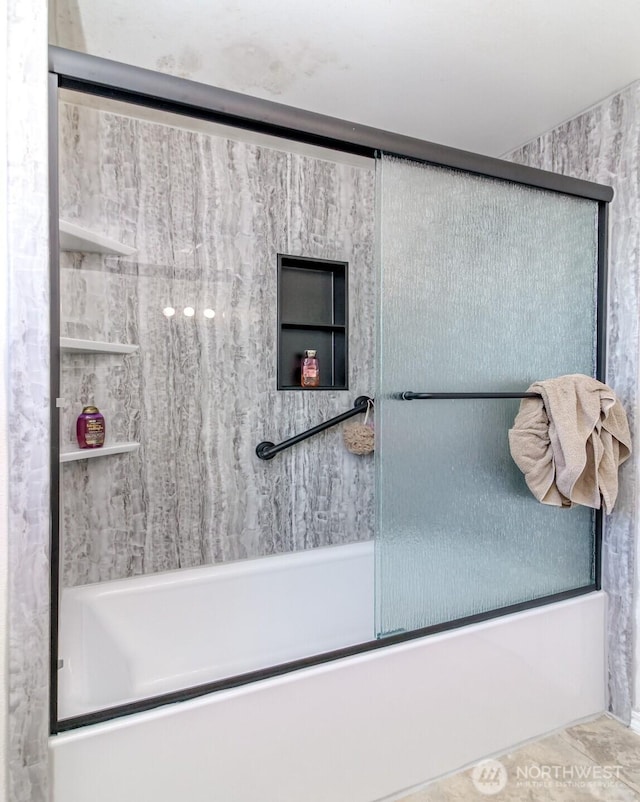 full bathroom featuring combined bath / shower with glass door