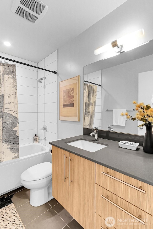 bathroom featuring tile patterned flooring, toilet, vanity, visible vents, and shower / bathtub combination with curtain