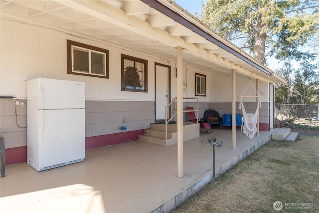 view of patio featuring fence