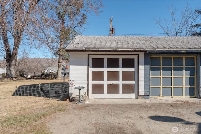 detached garage with fence