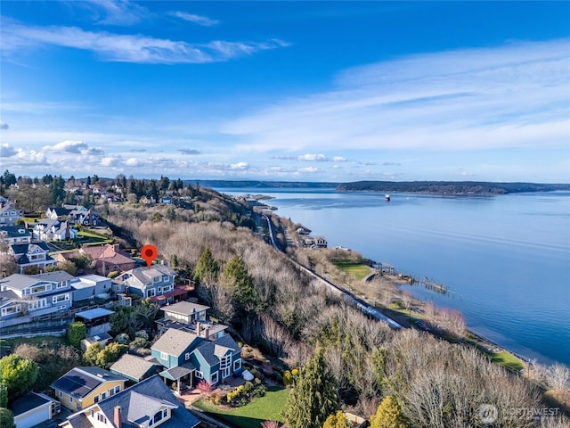 drone / aerial view with a residential view and a water view