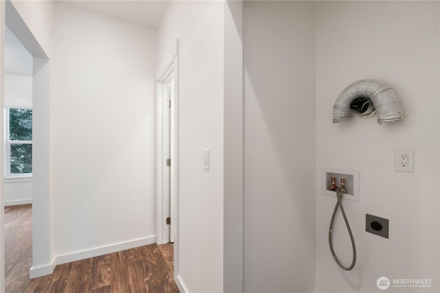 corridor with dark wood-type flooring and baseboards