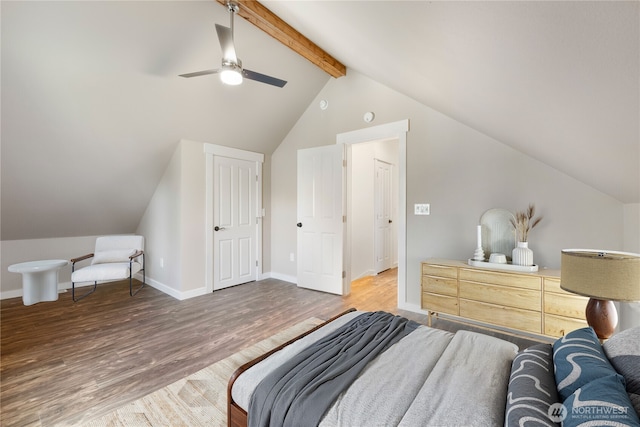 bedroom featuring lofted ceiling with beams, ceiling fan, baseboards, and wood finished floors