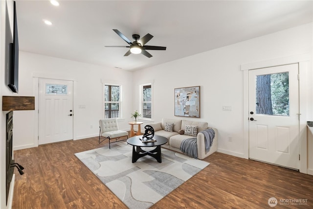 living room with baseboards, a ceiling fan, wood finished floors, and recessed lighting