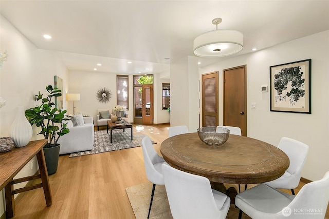 dining area featuring light wood-style floors and recessed lighting