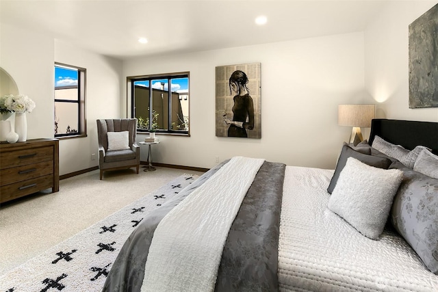 bedroom with carpet, multiple windows, baseboards, and recessed lighting