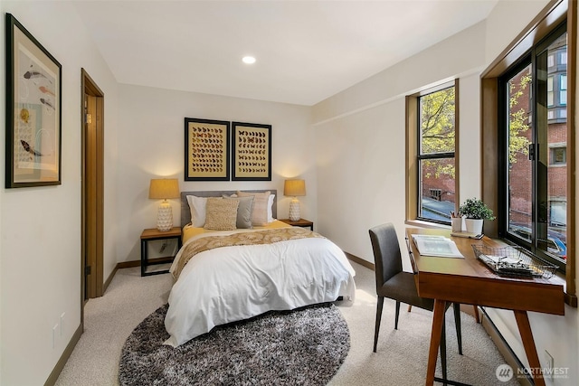 bedroom with light carpet, recessed lighting, and baseboards