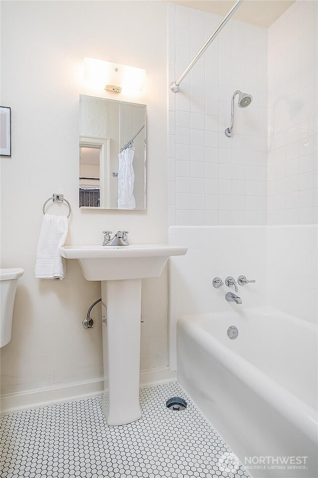 full bathroom featuring baseboards, shower / bath combo, and tile patterned floors