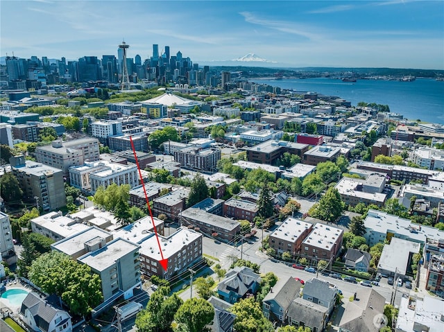 aerial view featuring a view of city and a water view