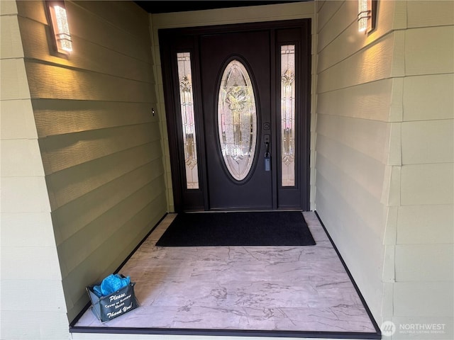 property entrance with concrete block siding