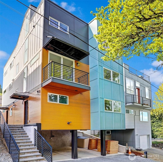 view of property featuring stairway and an attached garage