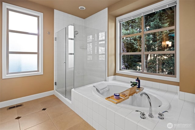 full bathroom with visible vents, a bath, baseboards, tile patterned floors, and a stall shower