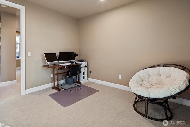 carpeted home office with baseboards