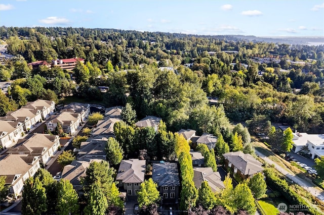bird's eye view featuring a residential view and a forest view