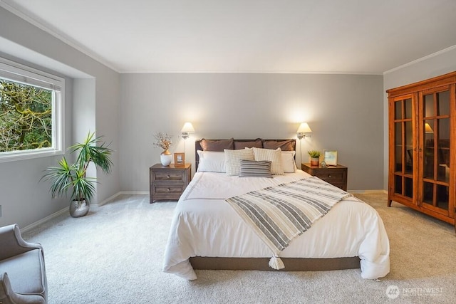 bedroom with carpet flooring, baseboards, and ornamental molding