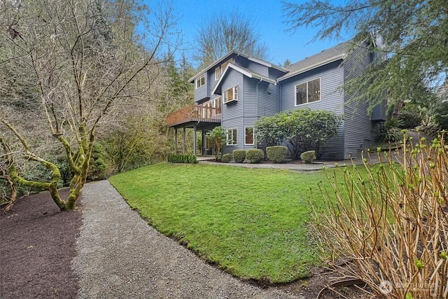 exterior space with a deck and a yard