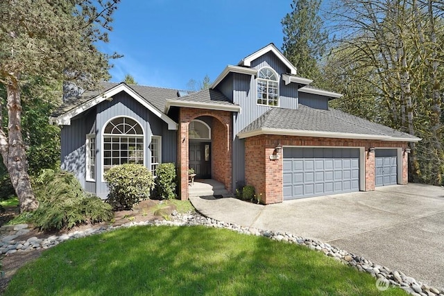 3140 240th Ave NE, Sammamish, WA 98074 - view of front of home featuring a garage, a front yard, driveway, and brick siding