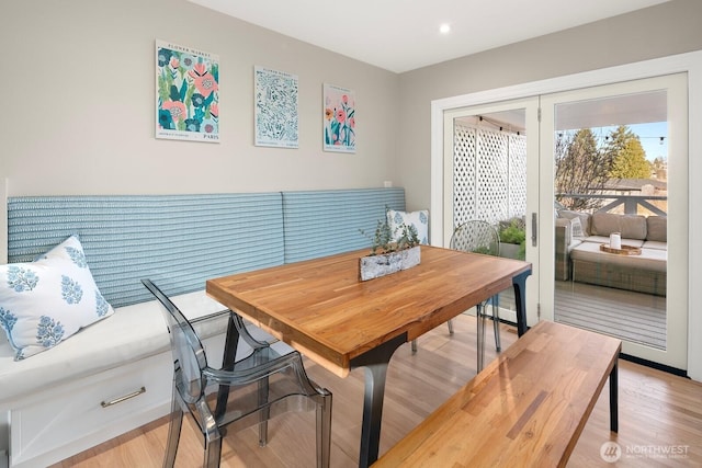 dining room featuring light wood-style flooring and recessed lighting