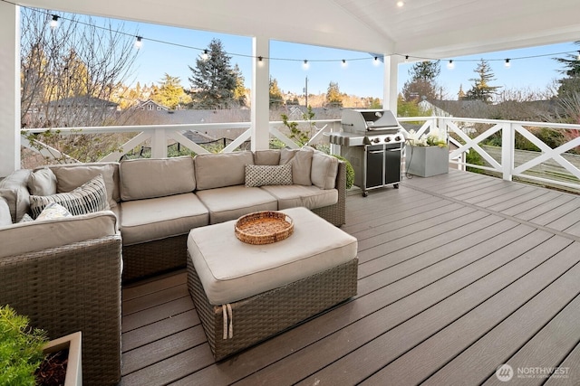 deck with a grill and outdoor lounge area