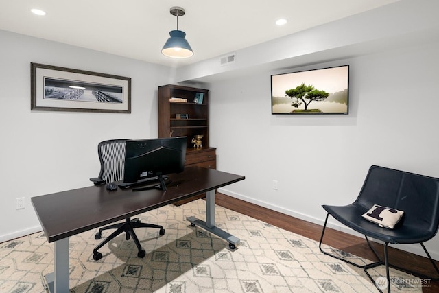 home office featuring recessed lighting, wood finished floors, visible vents, and baseboards