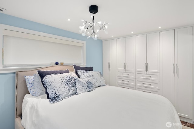 bedroom featuring visible vents, a chandelier, and recessed lighting