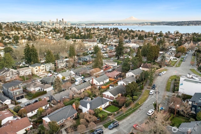 bird's eye view with a water view and a residential view