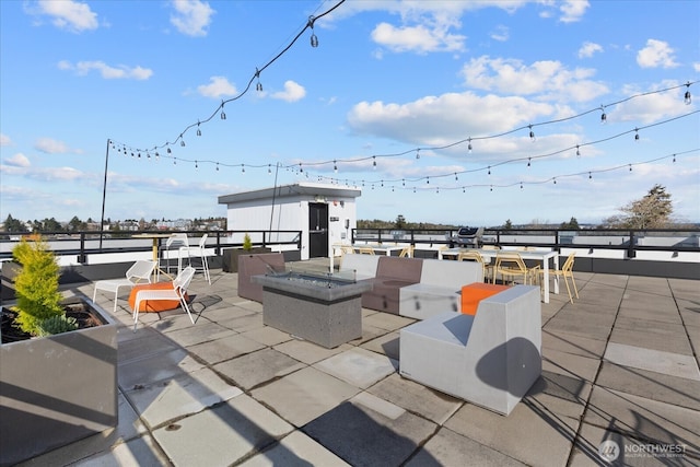 view of patio with a fire pit