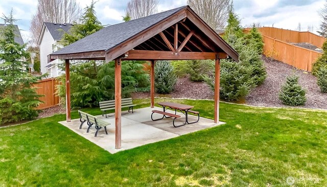 surrounding community featuring a gazebo, a patio area, a lawn, and fence