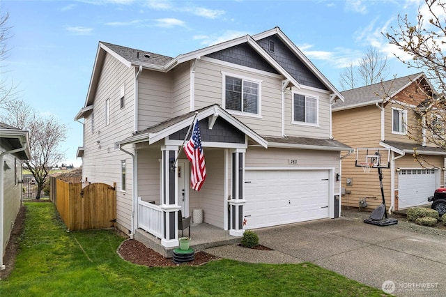 view of front of property with a front lawn, concrete driveway, a garage, and fence