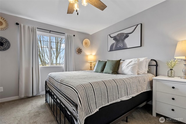 bedroom featuring baseboards, ceiling fan, and carpet floors